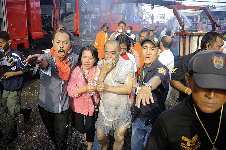 Picture desk live: Thai firemen and rescue workers help victims