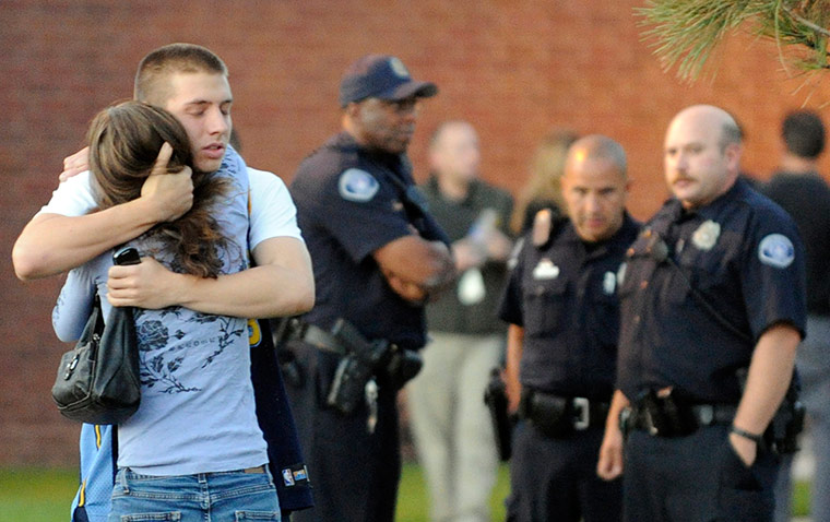 Denver shooting: Eyewitness Jacob Stevens, 18, hugs his mother Tammi Stevens
