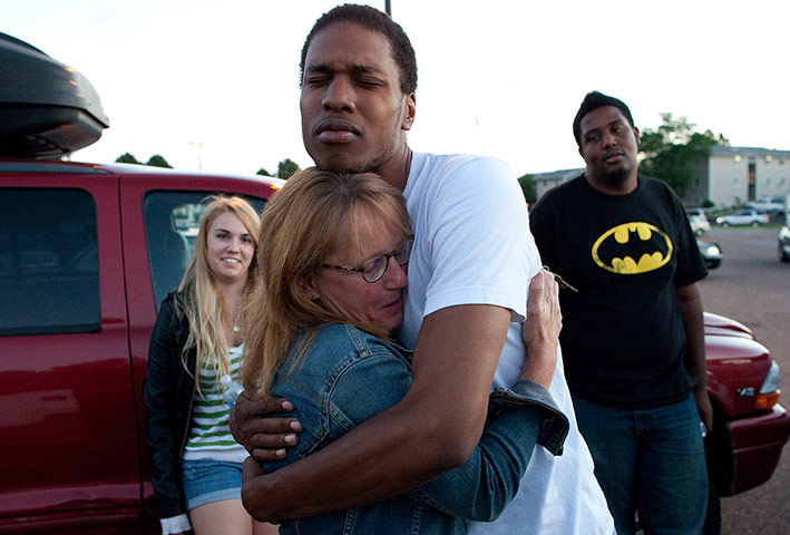 Denver shooting: Judy Goos hugs her daughters friend, Isaiah Bow