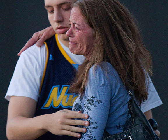 Denver shooting: Jacob Stevens, 18, hugs his mother Tammi Stevens