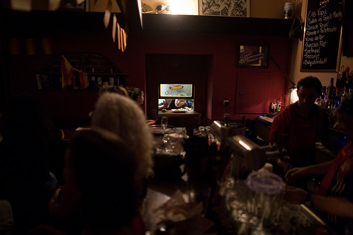From the agencies: Jose Manuel Abel gestures through a serving hatch as a kitchen assistant