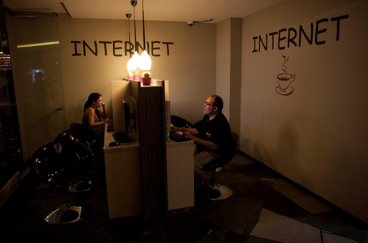 From the agencies: Jose Manuel Abel surfs the internet in the hostel 