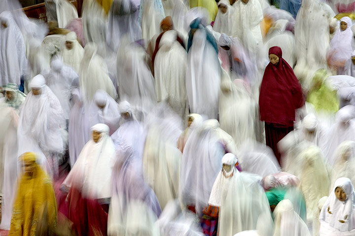 24 hours: Muslim women perform an evening prayer called 'tarawih' 