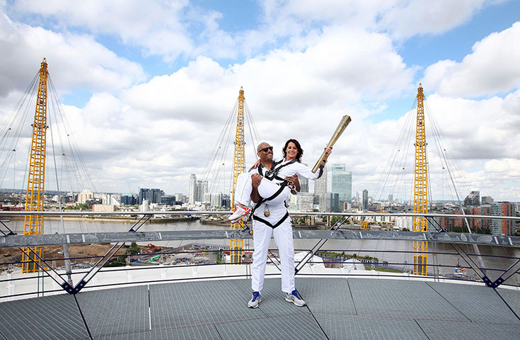 Torch day 64: John Amaechi and Nadia Comaneci