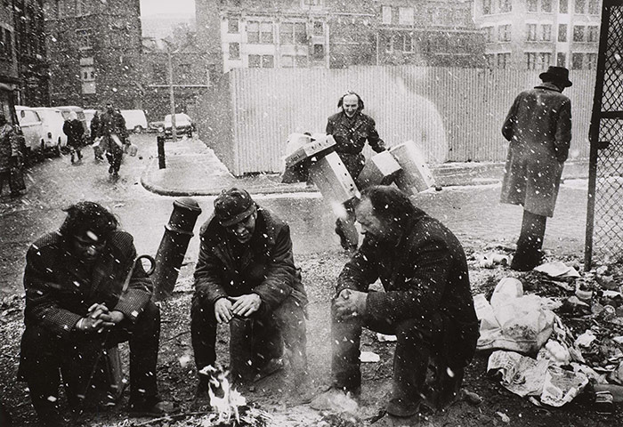 Another London: People around a fire, Spitalfields Market, London 1976 