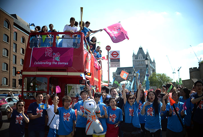 Olympic Torch 65: Members of the British Chinese Project pose with an Olympic torch 