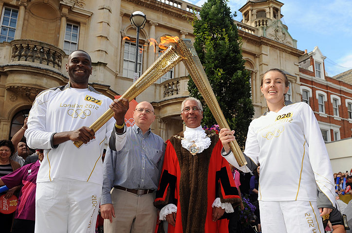 Olympic Torch 65: Luke Williams passes the Olympic Flame to Torchbearer