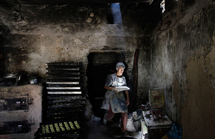 Picture Desk Live: A man prepares cookies to be eaten after ending the fast