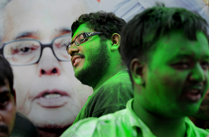 24 hours: Kolkata, India: National Congress activists apply gulal powdered colours