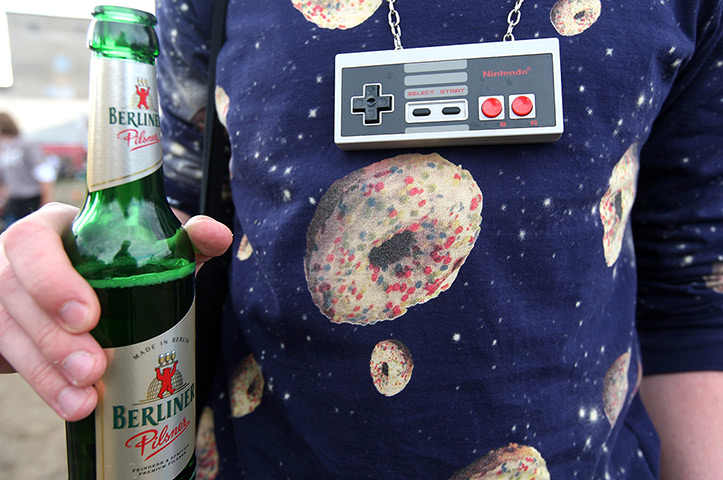 Hipster Olympics: An attendee wearing a 1980s Nintendo controller as a necklace 