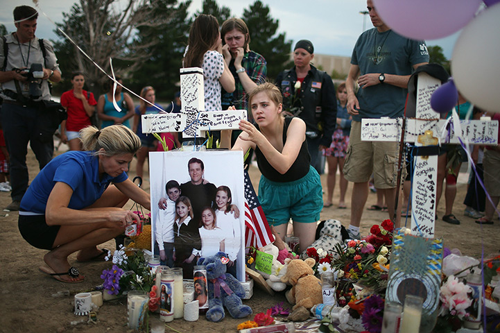 24 hours in pictures: Colorado Community Mourns In Aftermath Of Deadly Movie Theater Shooting