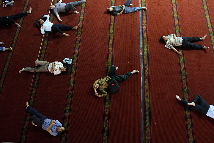 24 hours in pictures: Indonesian Muslim men sleep at Istiqlal Mosque