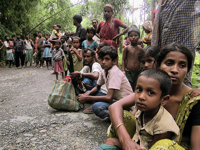 Picture desk live: Villagers wait to leave their homes after ethnic violence in Assam, India