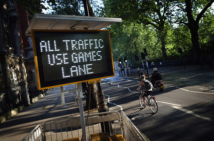 Picture desk live: A cyclist passes a Games Lane