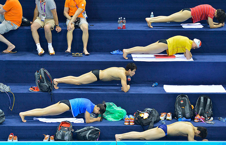 Picture desk live: Chinese swimmers perform strength exercises