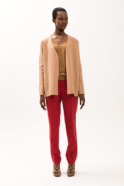 All Ages: Model wears a camel top and red trousers