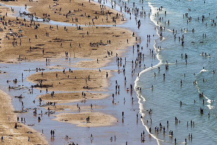 24 hours: Katwijk, The Netherlands: A crowded beach as people enjoy the sunny weather