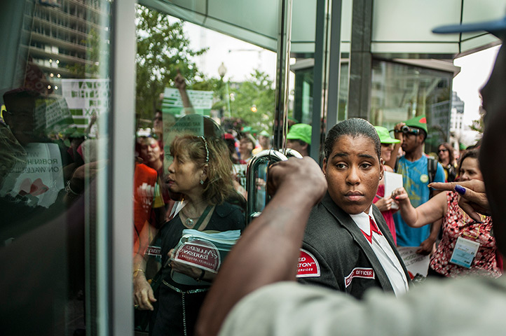 24 hours: Washington, DC, USA: A security guard looks on during an AIDS protest