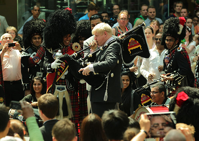 Picture desk live: Boris Johnson has a turn of the bagpipes in Barnet during the torch relay