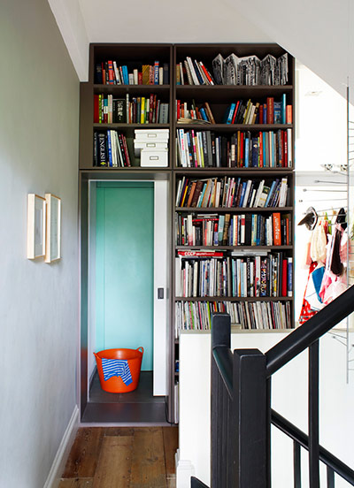 Homes - Narrow house: The landing has been turned into a library with a space-saving sliding door