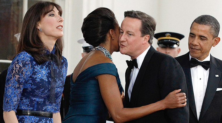 Politicians kiss: The Obamas and the Camerons at the White House, March 2012