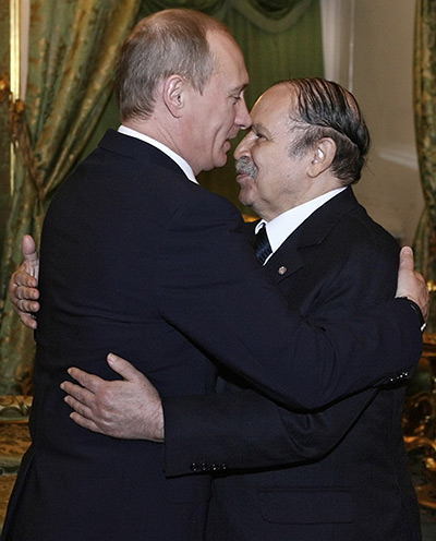 Politicians kiss: Vladimir Putin and Abdelaziz Bouteflika, February 2008