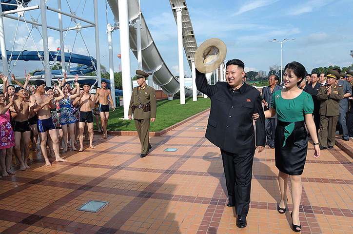 Kim Jong-un and wife: Kim Jong-Un waves to a crowd of swimmers 