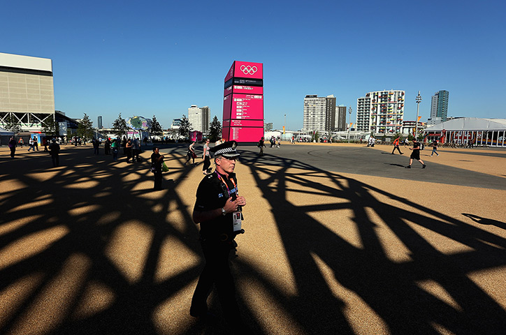 Olympic week build up: A policeman patrols before the rehearsal of opening ceremony Olympic Park
