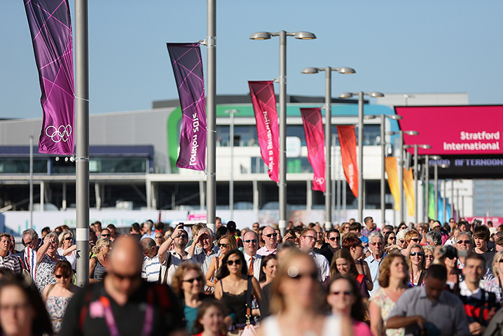 Olympic week build up: Visitors walk into the Olympic Park from Stratford international