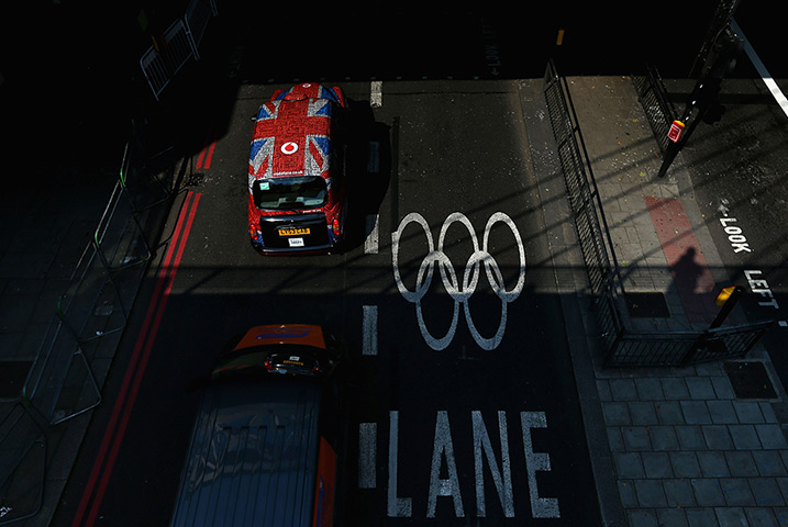 Olympic week build up: A London Taxi bearing the Union Jack on an Olympic Lane at Embankment