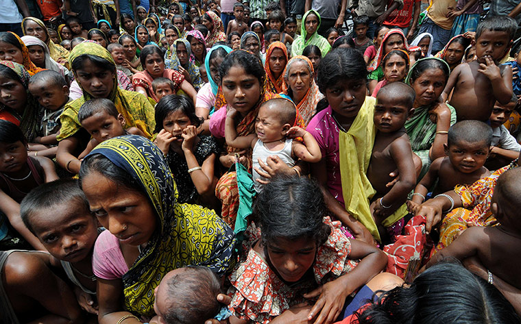 Picture desk live: Displaced villagers wait at a relief camp in Assam in India