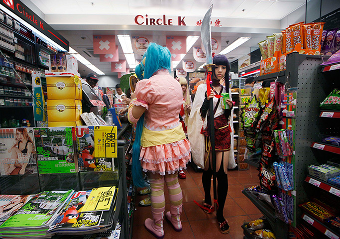 24 hours in pictures: People in outfits in shop during Comics Festival and Game Fair, Hong Kong 