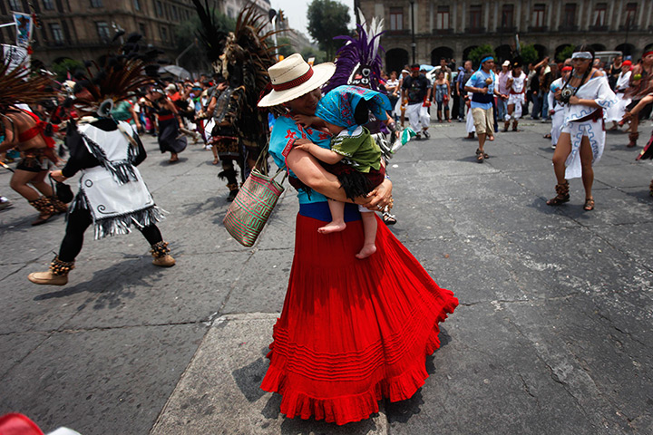 24 hours in pictures: Dancer performs during celebration Tenochtitlan at Zocalo square