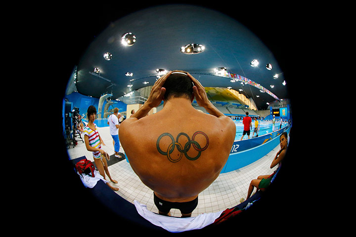 last day for relaxing: A diver prepares to take part in a training session at the Aquatics Centre 