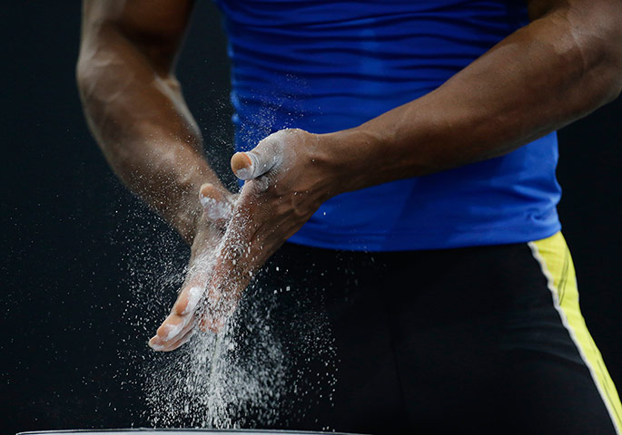 last day for relaxing: Jorge Arroyo Valdez of Ecuador, chalks his hands 