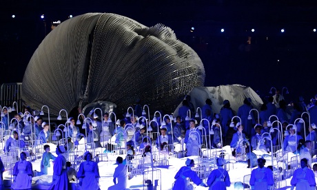 A giant model baby and nurses represent the NHS in a sequence during the London 2012 opening ceremony