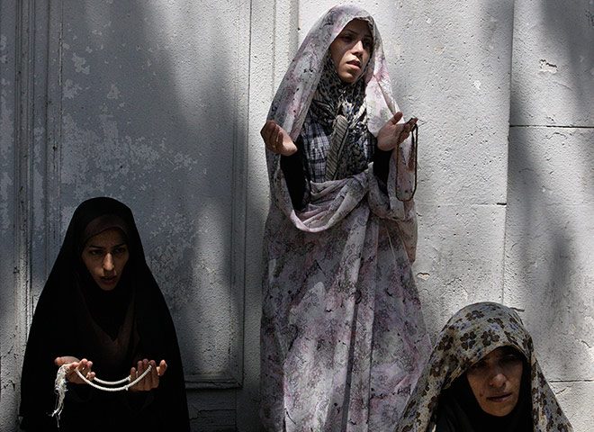 24 hours: women pray outside a University, during Muslims holy month of Ramadan