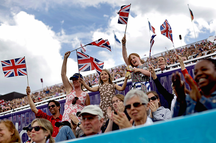 24 hours in pictures: Fans cheer at the equestrian eventing dressage at the Olympic Games