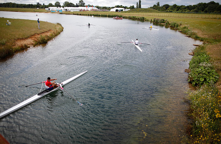 Olympic venues: Boats are guided down a channel at the rowing venue in Eton Dorney