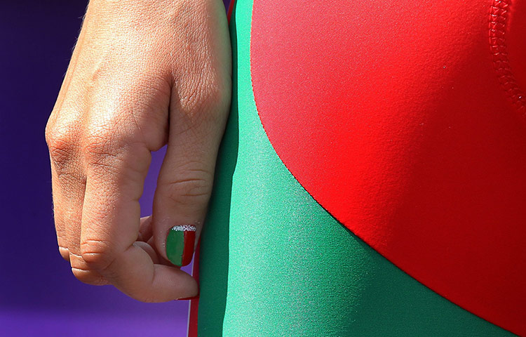 Women's road race: Belarus' Alena Amialiusik with national nail colors at the sign in ceremony
