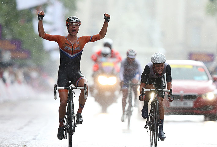Women's road race: Marianne Vos of Netherlands celebrates as she crosses the finish line