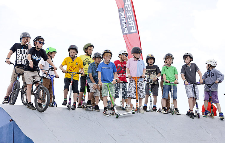 Camp Bestival: Kids prepare to ride their bikes and scooters down a ramp