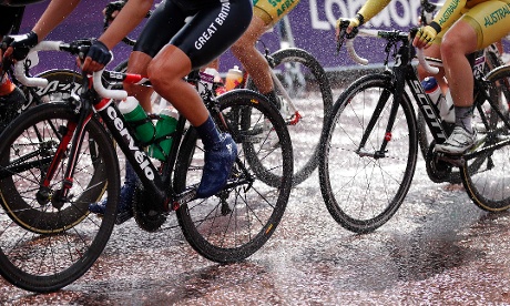 The cyclists had the worse of the weather it: riding through pouring rain during the women's road cycling race. Photograph: Matt Rouke/ AP