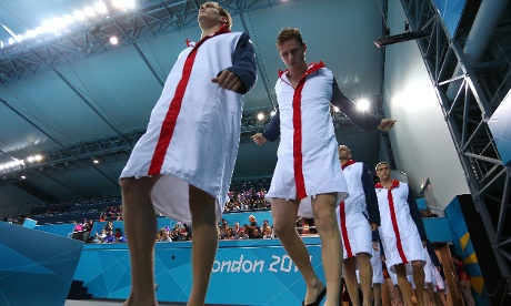 Great Britain team walk out onto pool deck ahead of their Men's Water Polo Preliminary Round Group B match 
