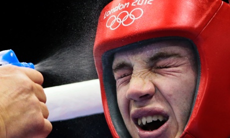 Great Britain's Freddie Evans is sprayed with water between rounds against Algeria's Ilyas Abbadi