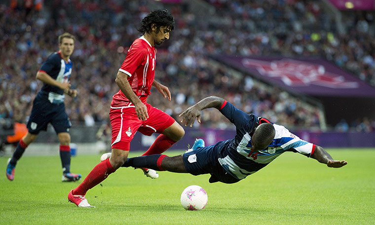 football3: Great Britain's Micah Richards (R) gets