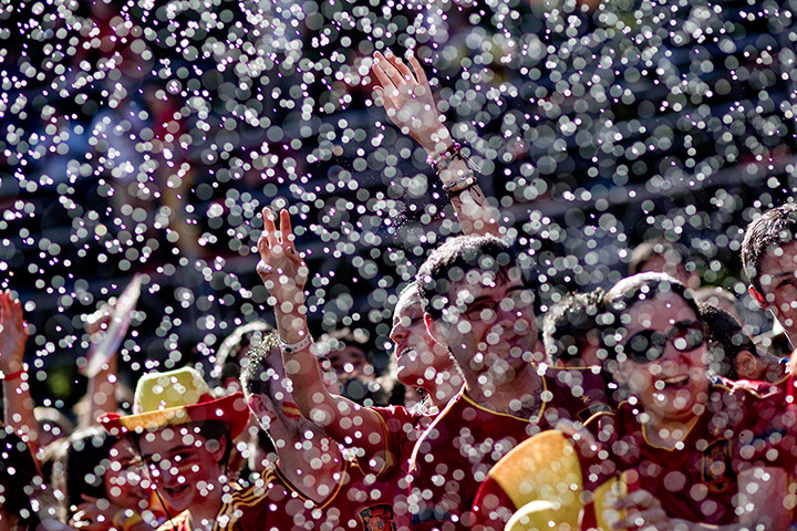 spain cele: Fireman spray Spanish fans