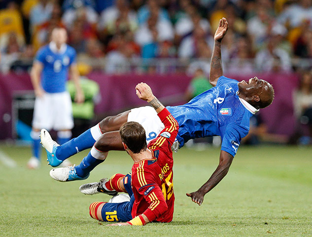 Euro picks: taly's Mario Balotelli after he is fouled by Spain's Sergio Ramos 