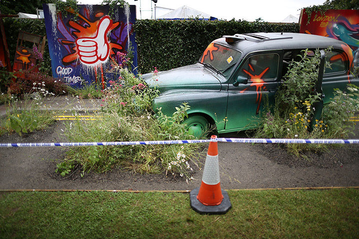 Hampton Court flower show: A London taxi, overgrown with flowers forms part of 'Riot of Colour' garden