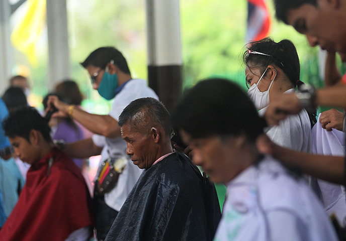 24 hours: Bangkok, Thailand: Passengers sit for free haircuts by beautician students